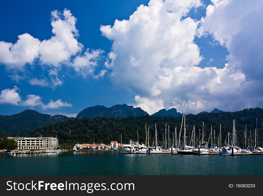 Marina with many yachts under blue sky. Marina with many yachts under blue sky.