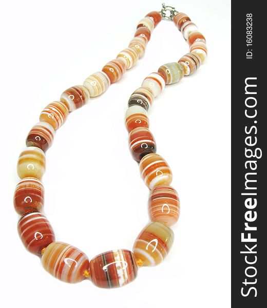 Red and orange with white lines agate colored beads isolated on white background. Red and orange with white lines agate colored beads isolated on white background