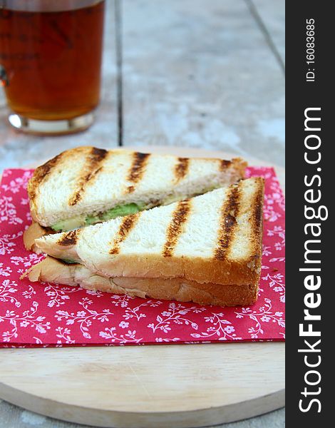 Sandwich with avocado on a red napkin