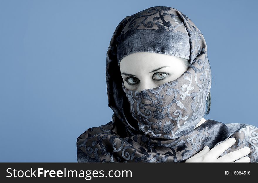 Arab woman wearing veil, cold light