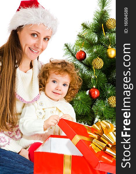 Mother and little daughter opening a present box. Mother and little daughter opening a present box