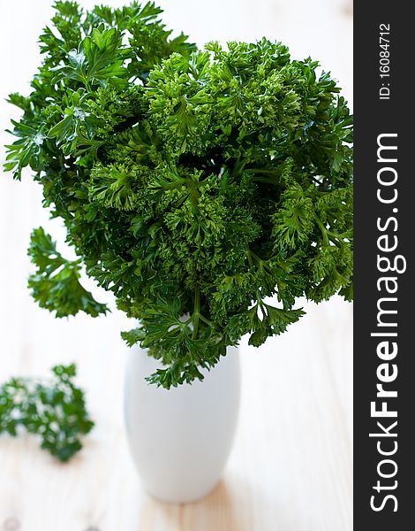 Fresh parsley leaves over the table. Fresh parsley leaves over the table