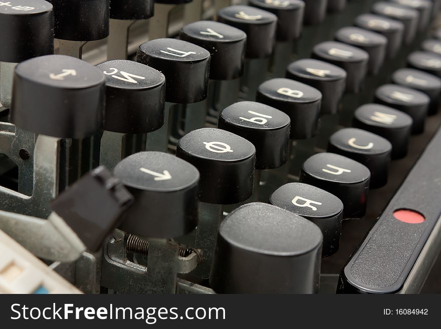 Closeup shoot of old typing device with Russian letters.