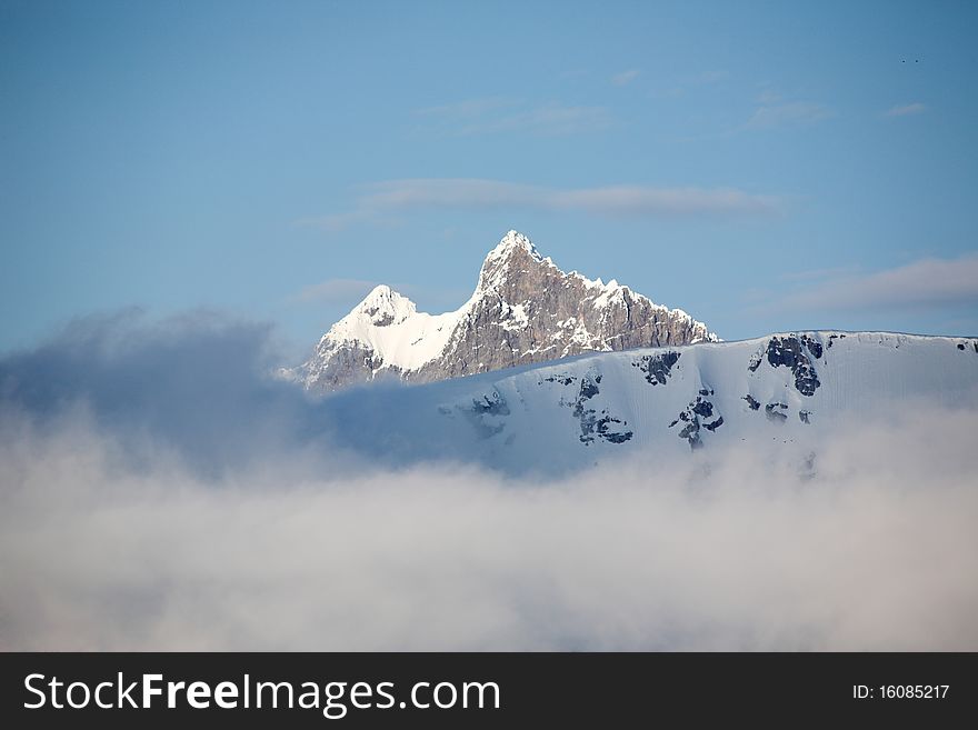 Mountain landscape - high mountains in clouds