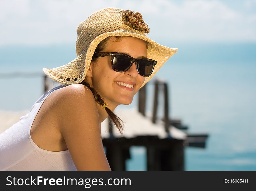 Happy young girl in white tank top