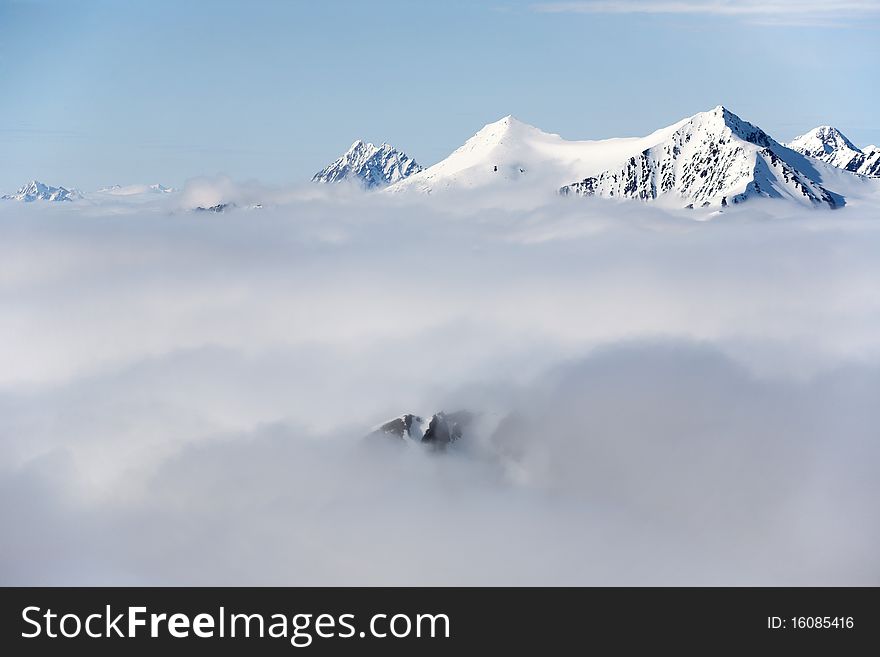 Mountain landscape - high mountains in clouds