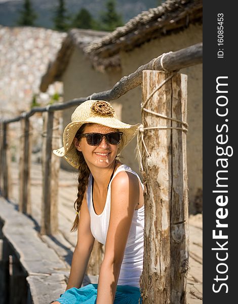 Happy young girl in white tank top