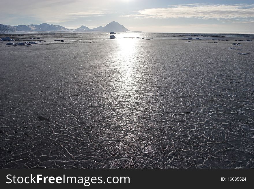 Arctic winter landscape - frozen sea, mountains. Arctic winter landscape - frozen sea, mountains