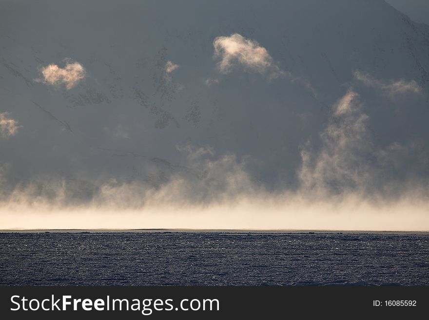 Arctic landscape - fog over the sea