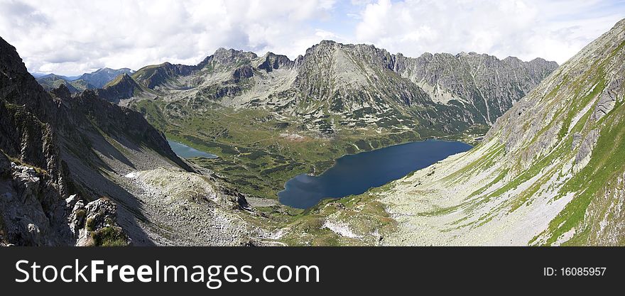 Mountain summer landscape - summits, valley, lake - panorama. Mountain summer landscape - summits, valley, lake - panorama