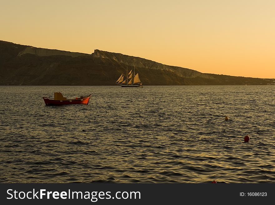 Sunset over port of Mykonos, Greece