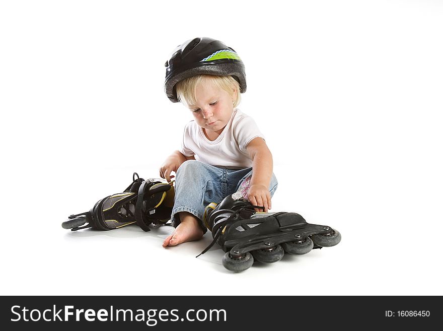 Cute toddler with rollerskates