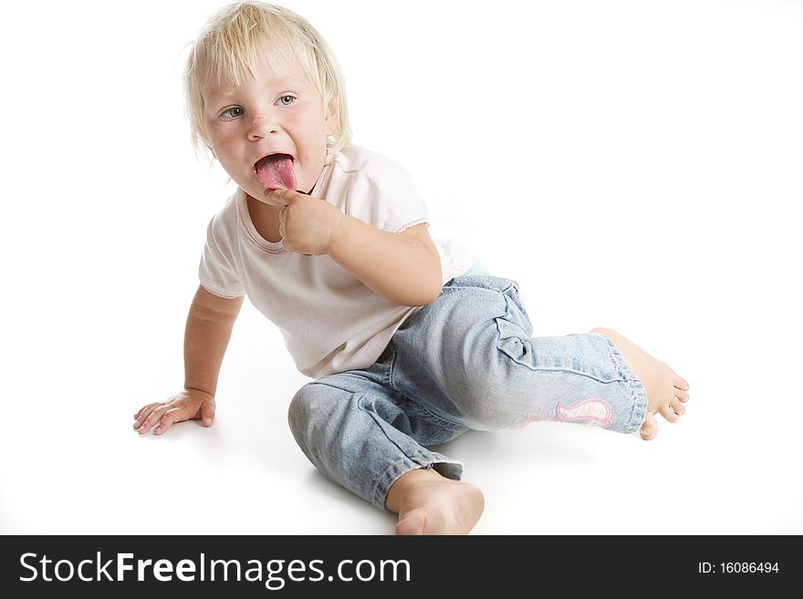 Funny portrait of cute toddler girl over white