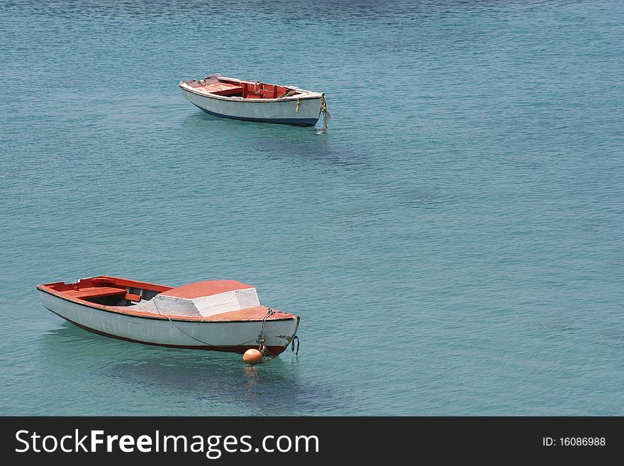 Wooden boats anchored of a beach in Curacao. Wooden boats anchored of a beach in Curacao