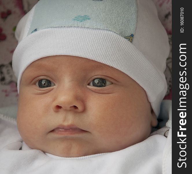 Baby in a cap with beautiful eyes. Baby in a cap with beautiful eyes