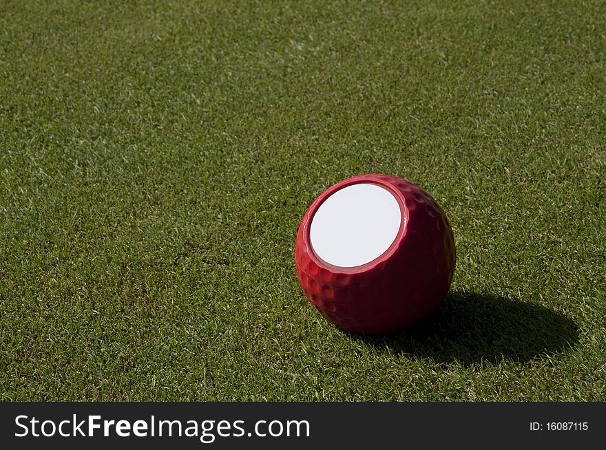 Ball for golf on a green lawn. Ball for golf on a green lawn