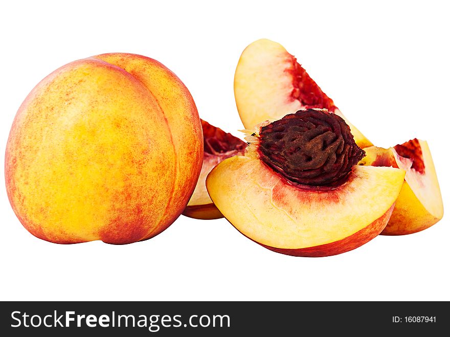 whole nectarine and cut on shares with a stone isolated on a white background