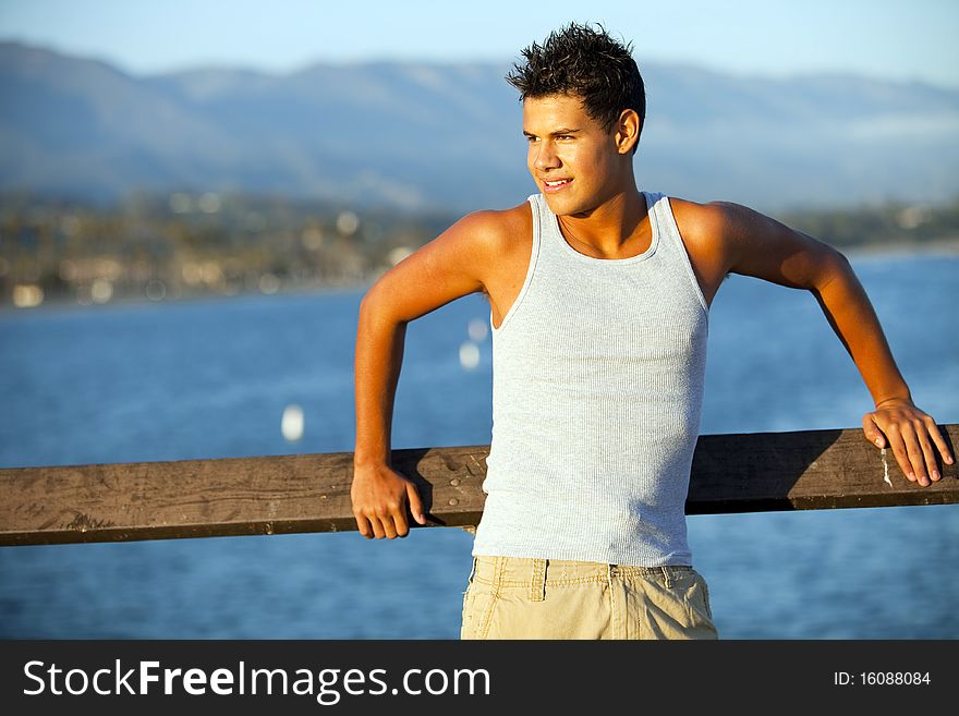 Young man standing on the pier. Young man standing on the pier