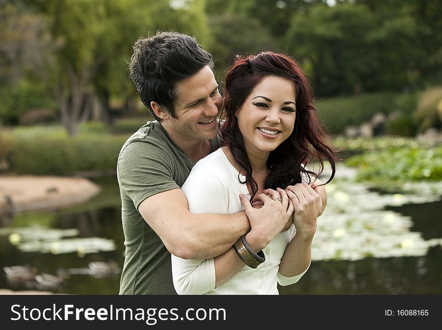 Young attractive couple in love at a park