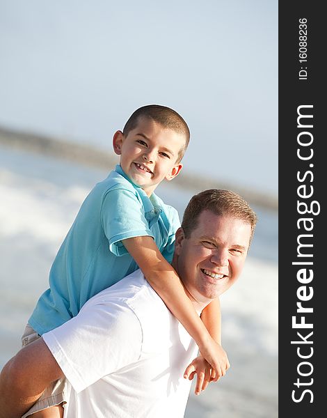 Father and son playing on the beach