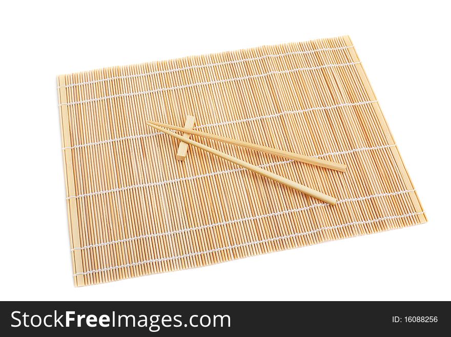 Chopsticks Isolated On Bamboo Mat