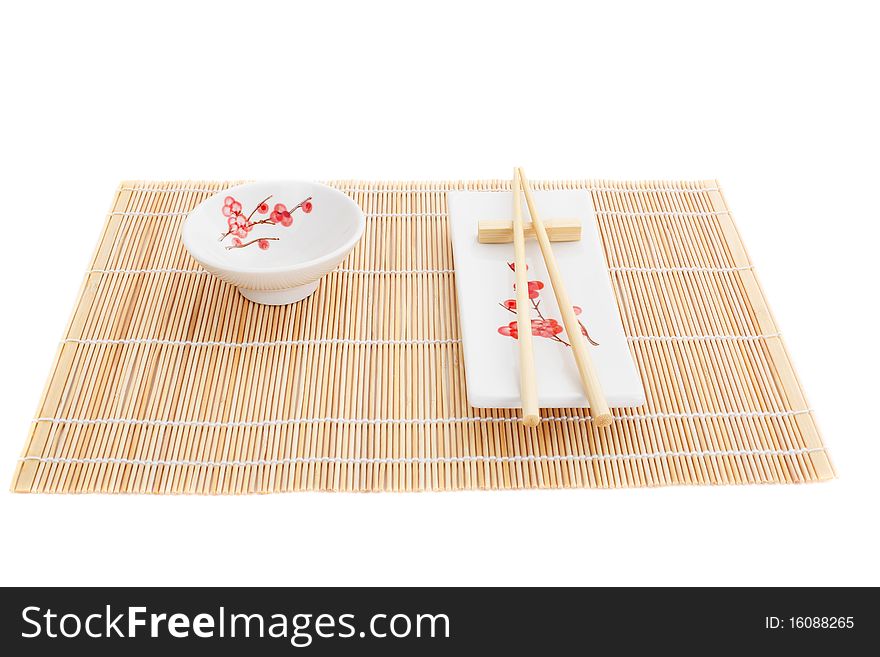 Series. Sushi plates and chopsticks on bamboo mat