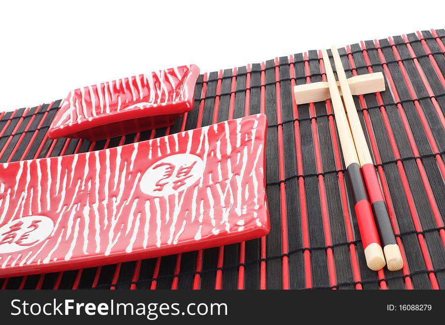 Series. Sushi plates and chopsticks on bamboo mat