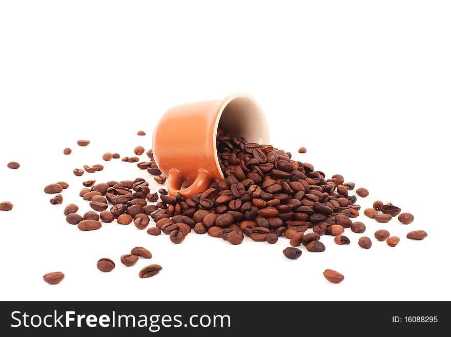Cup and coffee beans isolated over white