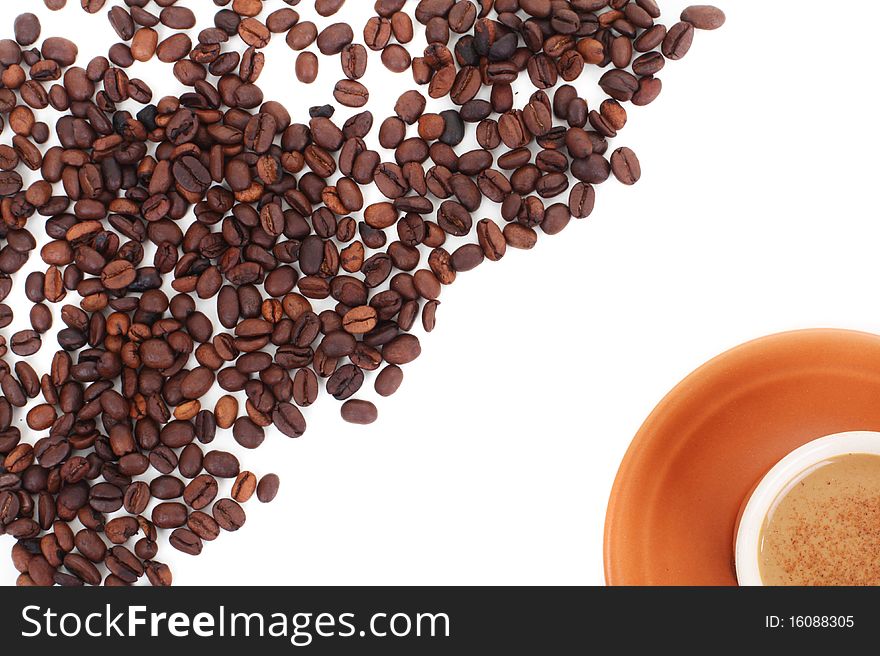 Cup and coffee beans isolated over white