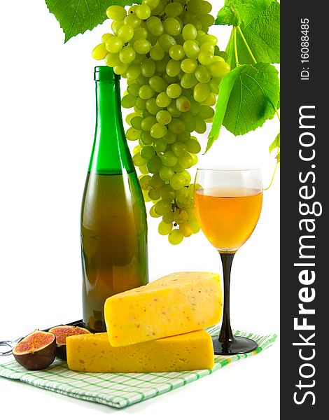 Bottle of wine, glass and grapes isolated on white