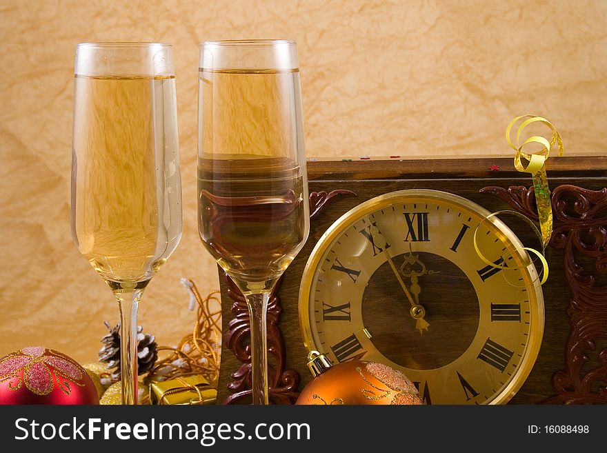 Decoration with a clock, christmas balls and champagne glasses. Decoration with a clock, christmas balls and champagne glasses