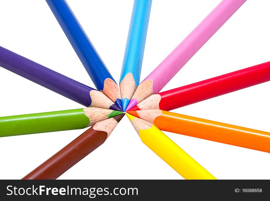 Nine different colored pencils in circle on white background, triangular shaped for correct pencil grip