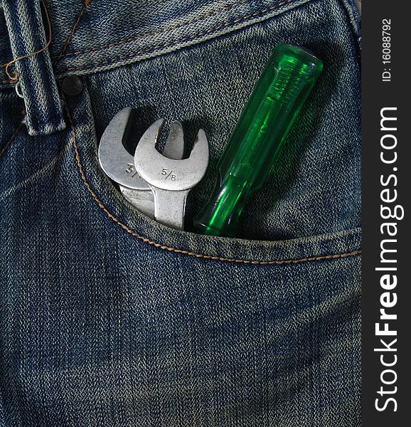 Blue jean pocket with spanners and screwdriver