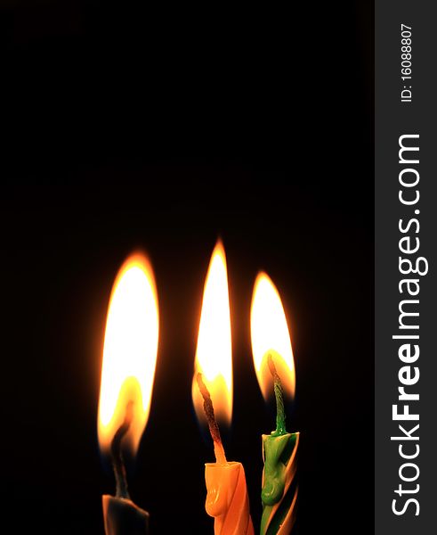 Candles isolated on black background