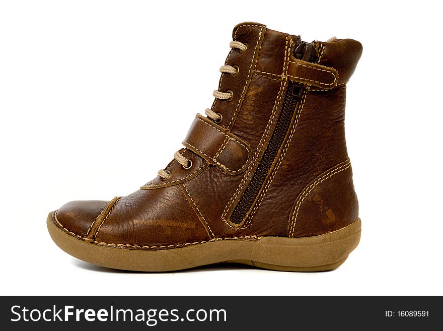 A brown high boot. The boot is taken on a white background.