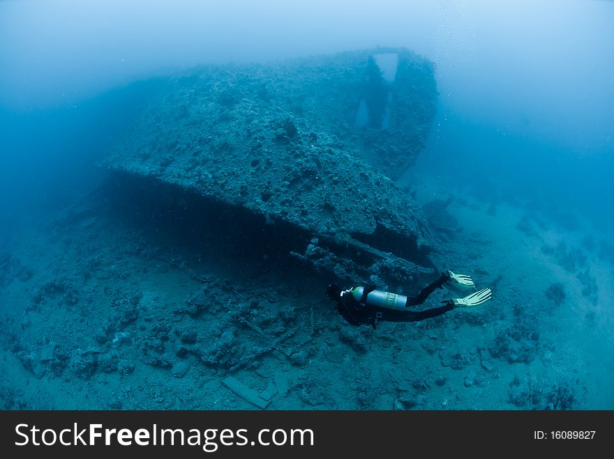 A female scuba diver exploring the stern of the SS Dunraven. Beacon rock, Ras Mohammed national Park, Red Sea, Egypt. A female scuba diver exploring the stern of the SS Dunraven. Beacon rock, Ras Mohammed national Park, Red Sea, Egypt.