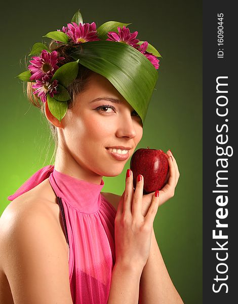 Beautiful spring-woman with red apple. Beautiful spring-woman with red apple