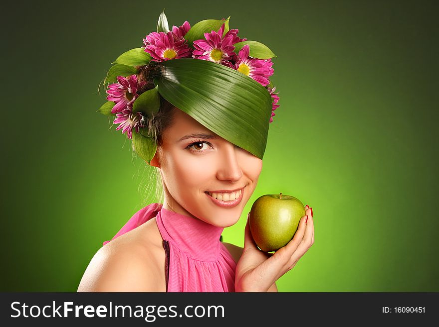 Beautiful spring-woman with green apple