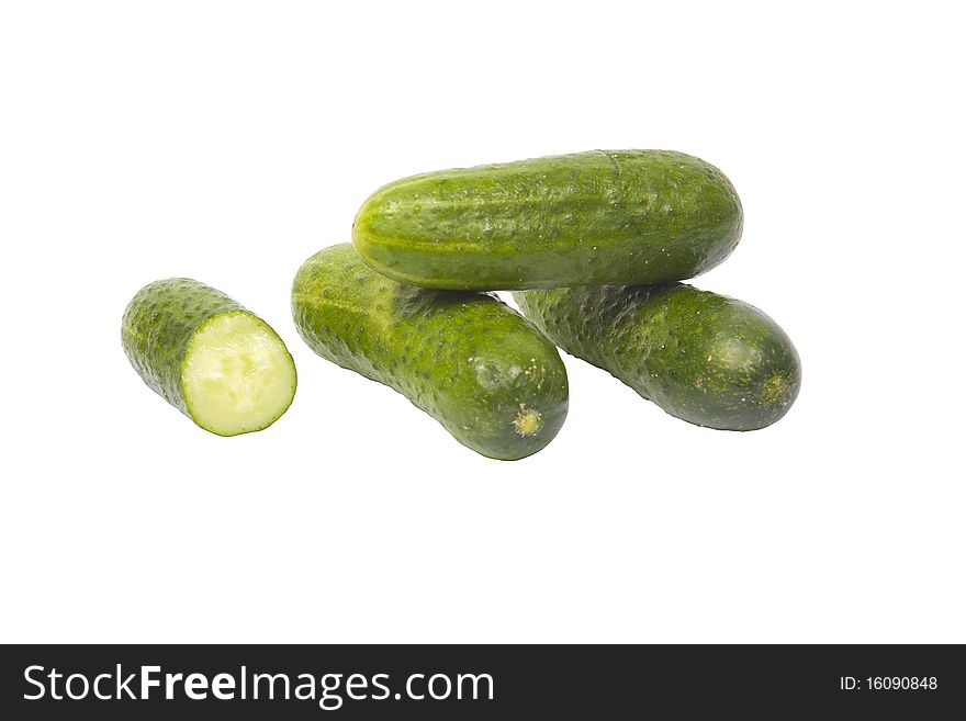 Four fresh cucumbers isolated on a white background