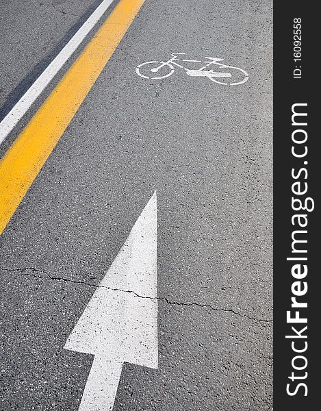 White bicycle sign painted on a street. Empty bike lane in Turin, Piedmont, Italy.