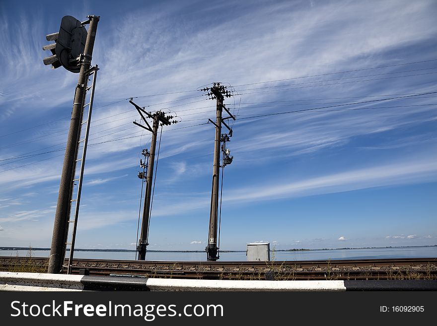 Electric poles along the railroad on natural background. Electric poles along the railroad on natural background.