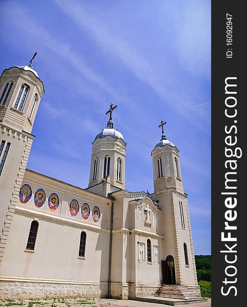 Church on a blue sky background located south of Danube river in Romania. The name of the church is St. Andrei.