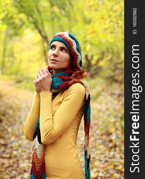 Young girl walking in autumn park. Young girl walking in autumn park