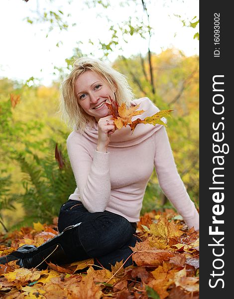Beautiful blond woman in autumn park. Beautiful blond woman in autumn park