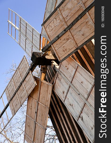 Traditional wood windmill house, romanian traditional architectural style, life in the countryside. Traditional wood windmill house, romanian traditional architectural style, life in the countryside.