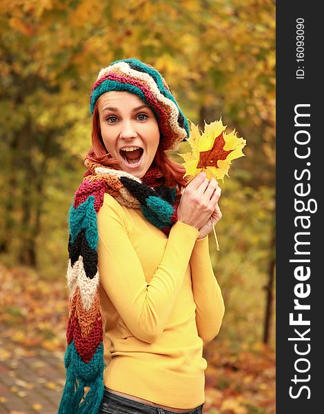 Young girl walking in autumn park. Young girl walking in autumn park