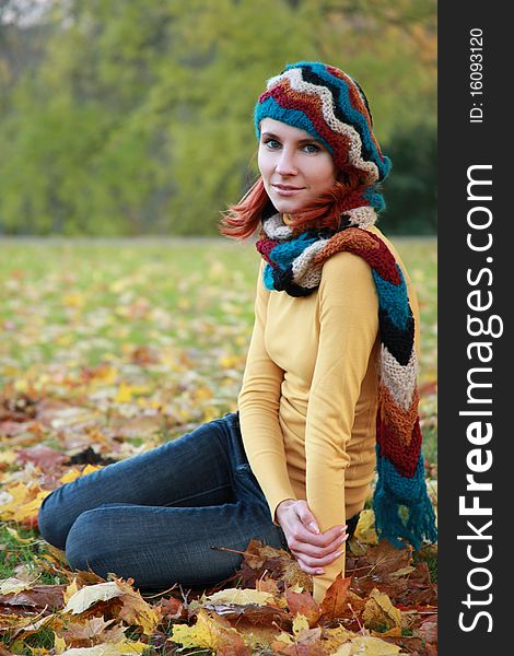 Young girl walking in autumn park. Young girl walking in autumn park