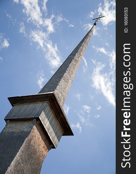 Traditional wood church tower from Maramures, Romania. Romanian traditional architectural style, life in the countryside.