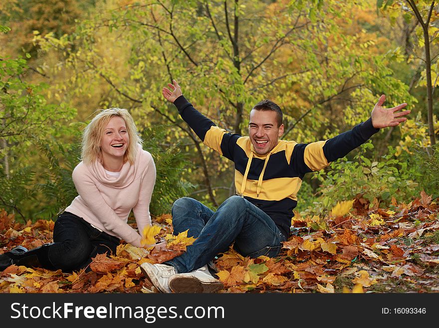 Beautiful couple having fun in autumn park. Beautiful couple having fun in autumn park