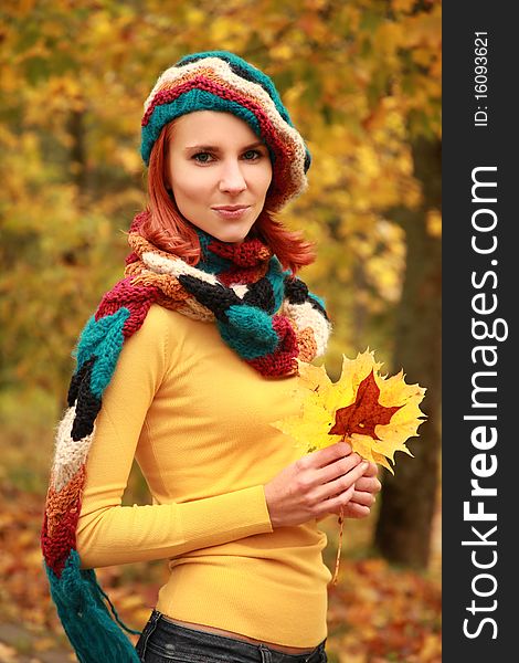 Young girl walking in autumn park. Young girl walking in autumn park